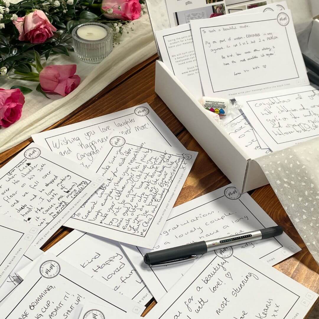 Close up of some completed Mr & Missive postcards showing handwritten messages for their wedding guest book alternative.