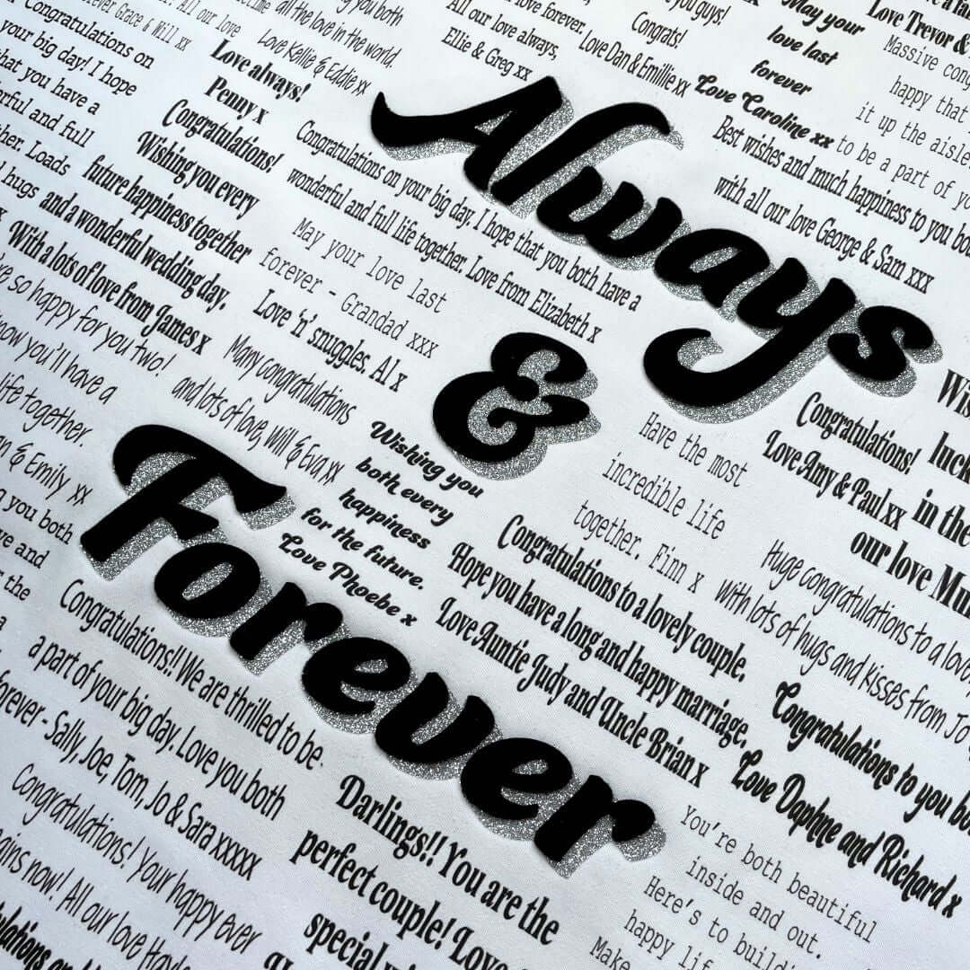 Close up of the typed collection Mr & Missive wedding guest book alternative centrepiece featuring a  black velvet centrepiece with silver shadow font.