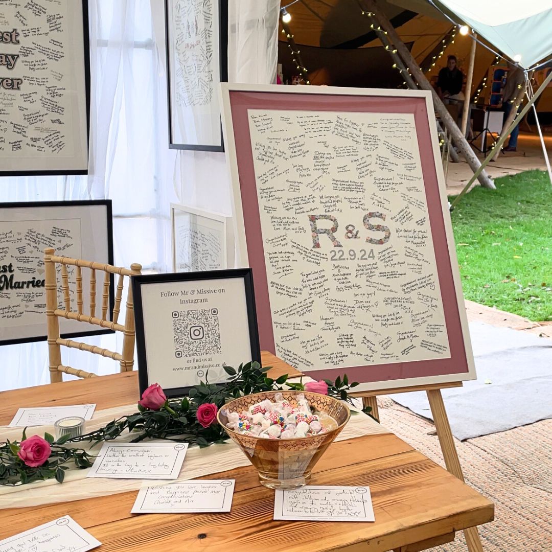 A handwritten Mr & Missive wedding guest book alternative from the Floral Collection with a hand-embroidered centrepiece and rose pink picture mount.